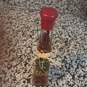 Red Glass Art Bottle with Decorative Design